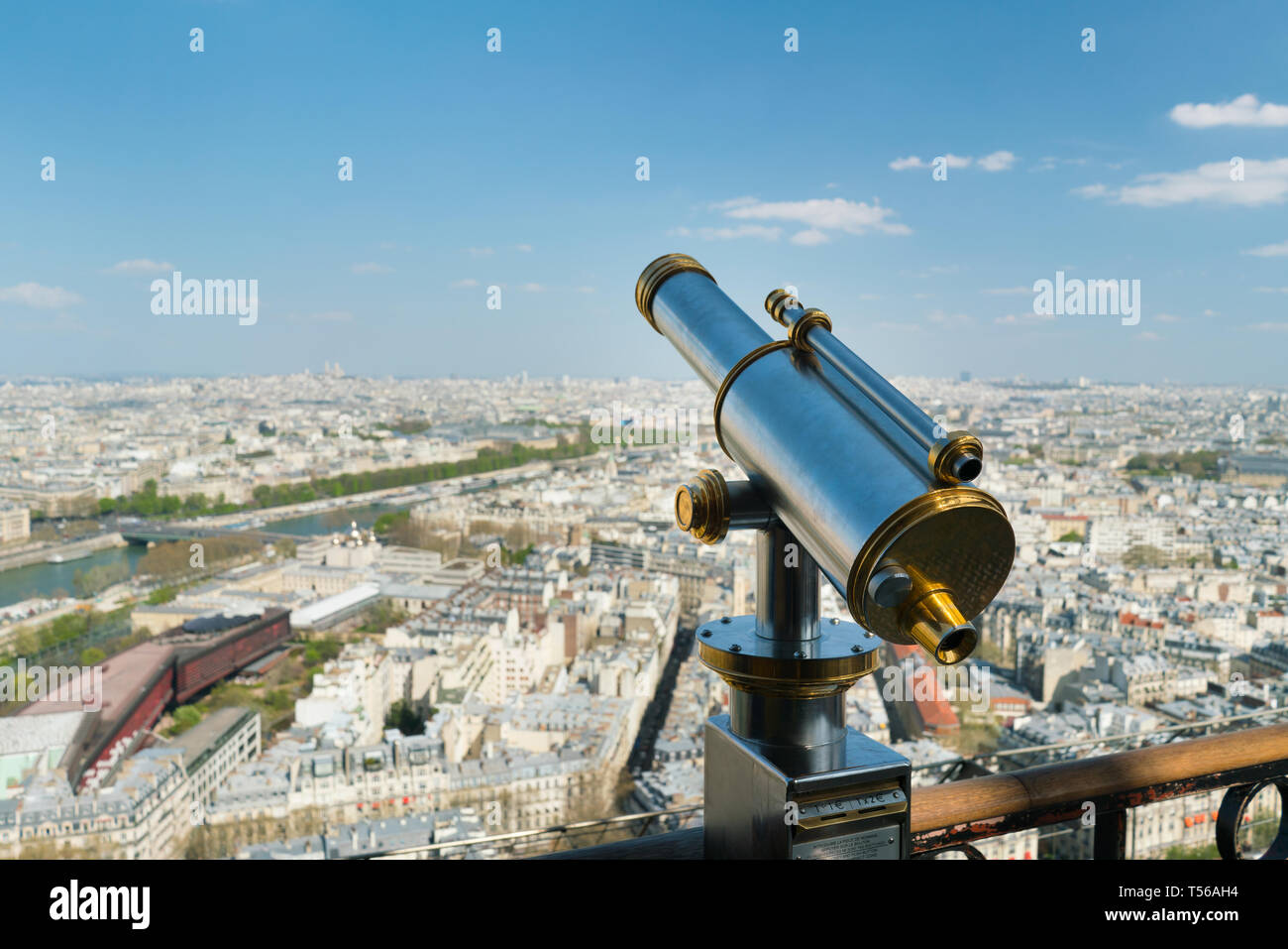 Monocle or tourist telescope on the observation deck with cityscape Stock Photo