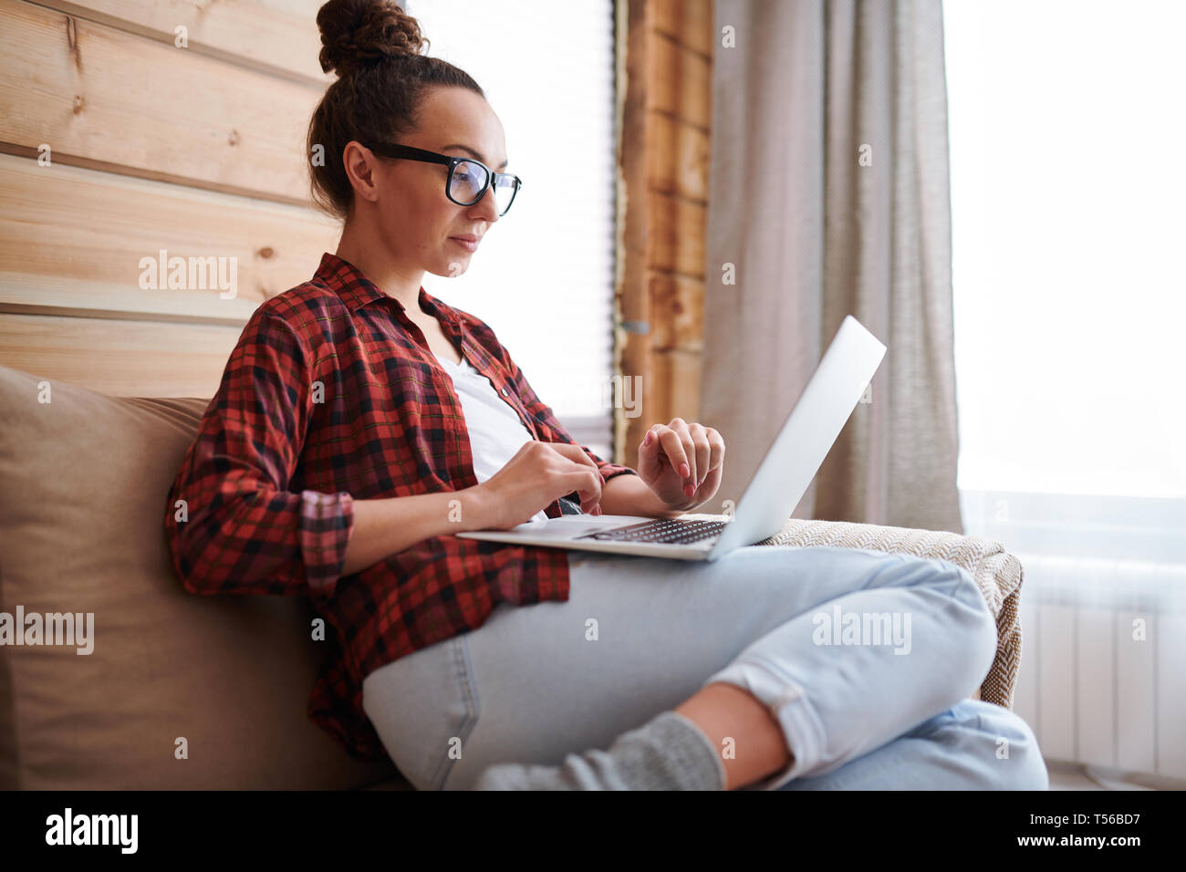 Working on couch Stock Photo Alamy