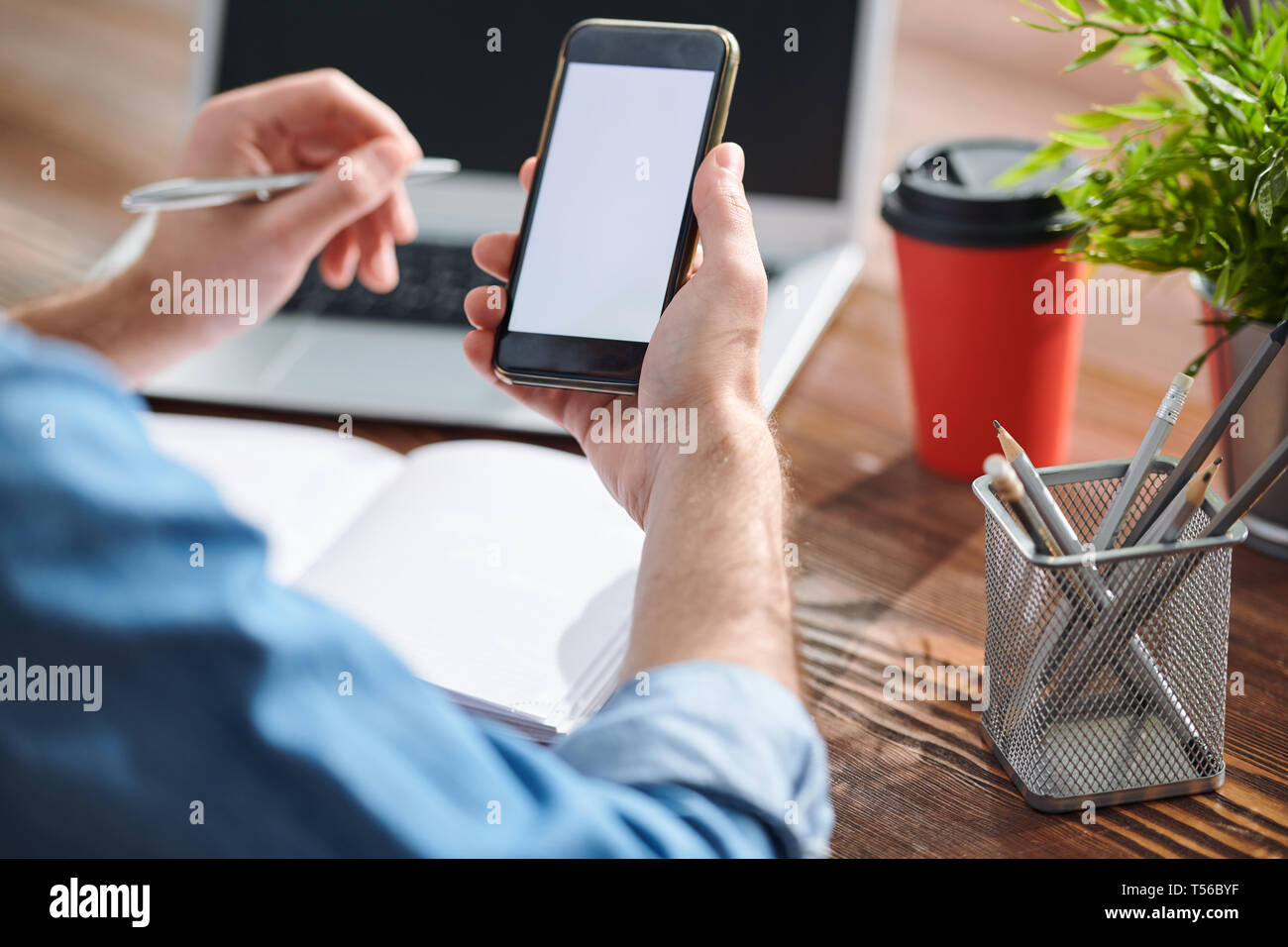 Manager using smartphone Stock Photo