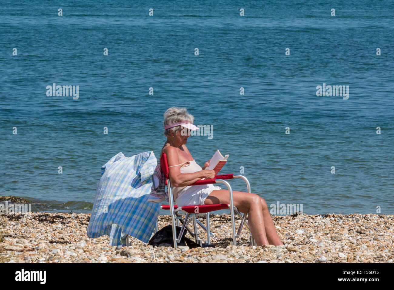 Elderly lady sitting in a chair hi-res stock photography and images - Alamy