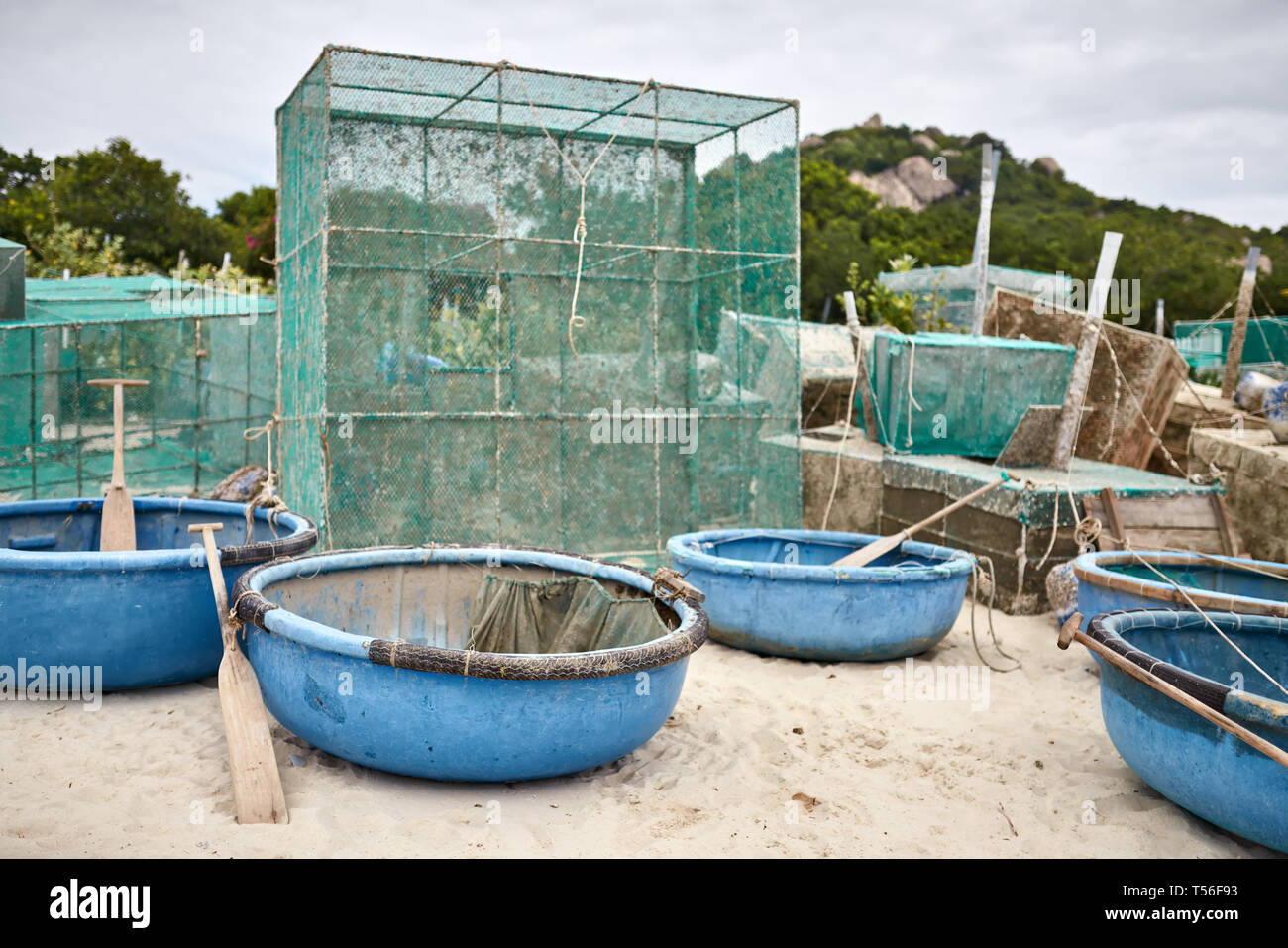 Lobster netting cages on sand beach in Vietnam Stock Photo - Alamy