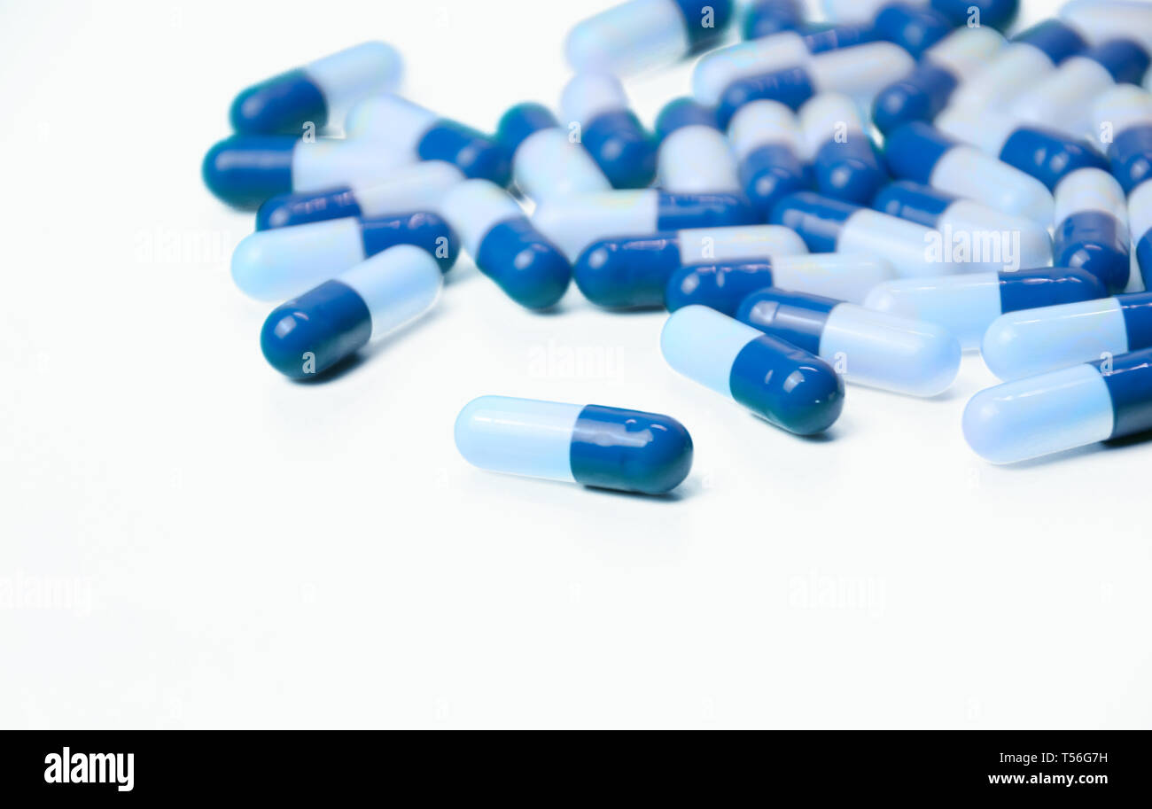 White and blue capsules isolated Stock Photo Alamy