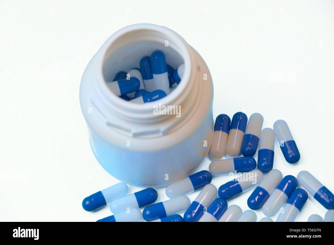 White and blue capsules isolated Stock Photo Alamy