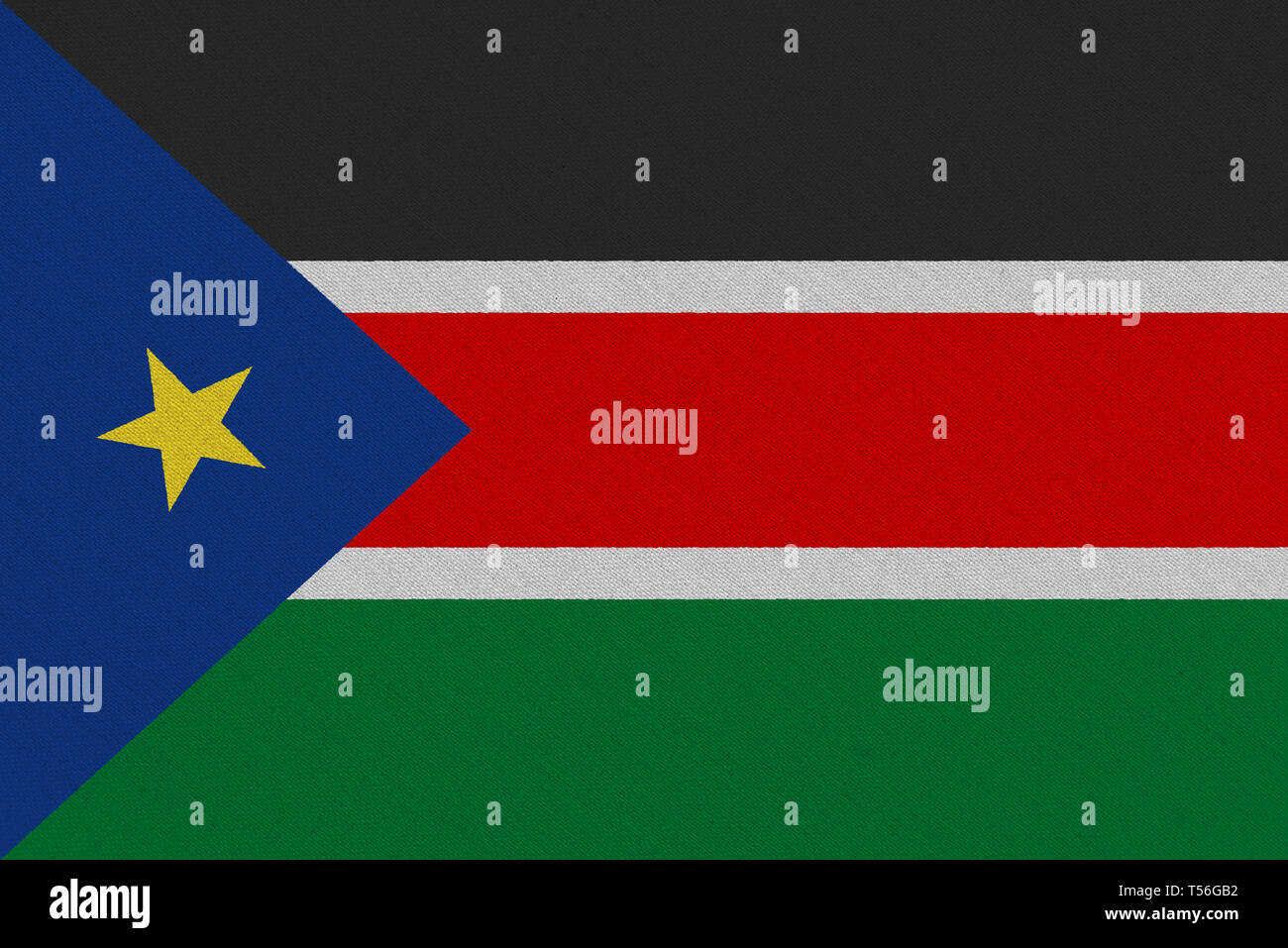 South Sudan fabric flag. Patriotic background. National flag of South Sudan Stock Photo