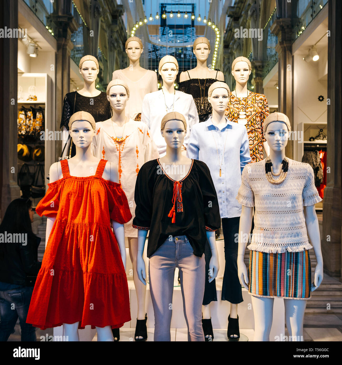 Athens, Greece - 26 Mar 2016: Square image of Mannequins wearing H and M  fashion clothes inside store on Ermou 54 street with multiple led lights  inside the old vintage building Stock Photo - Alamy
