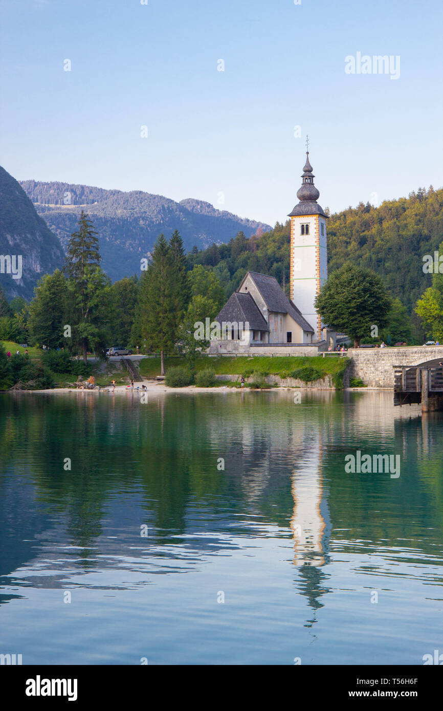 Bohinj Lake, Church of St John the Baptist with bridge. Triglav ...