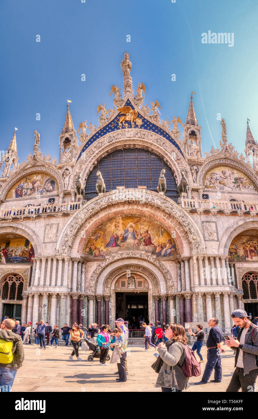 Venice, Italy - April 17 2019: Basilica San Marco on Saint Mark's Square. The iconic landmark of Venice attracts thousands of visitors each day. Stock Photo