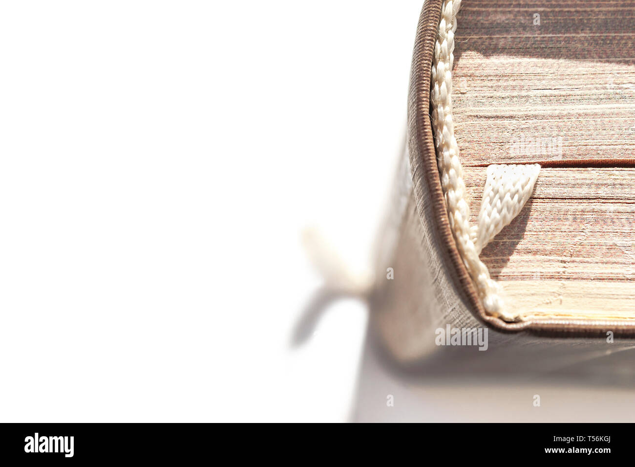 Top View of a Hardcover Book with Head, Spine and a White Fabric Bookmark Isolated on White Background. Reading, Textbook, Business Leger, Cookbook, F Stock Photo