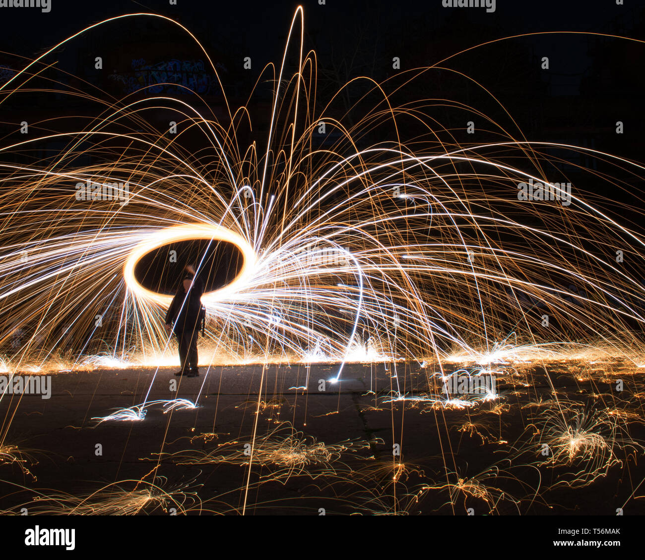 Man spinning sparkler firework at night made of steel wool Stock Photo Alamy