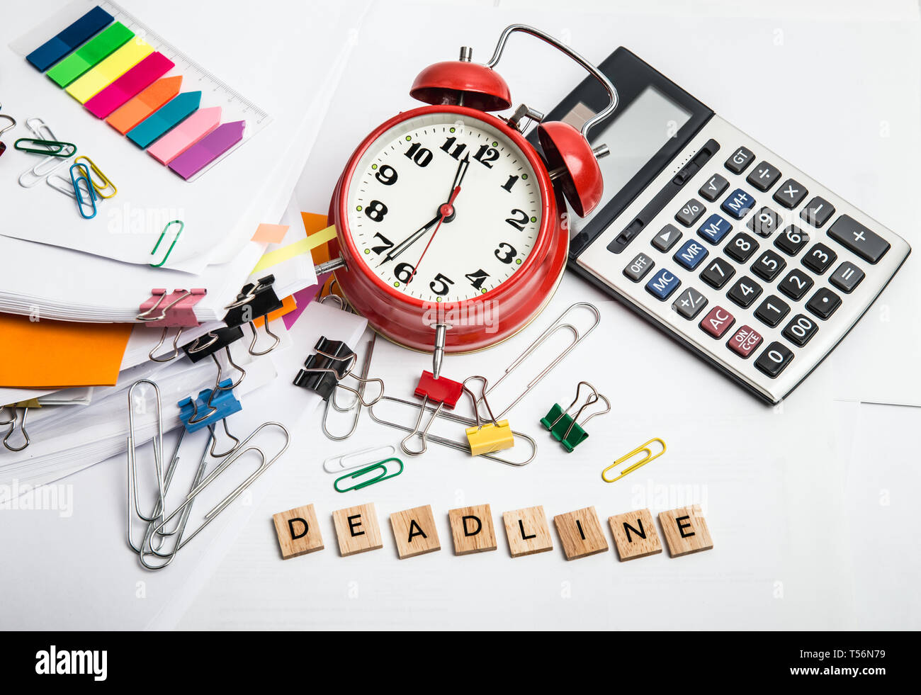 Time management concept. Composition with documents, stationary and alarm clock on table Stock Photo