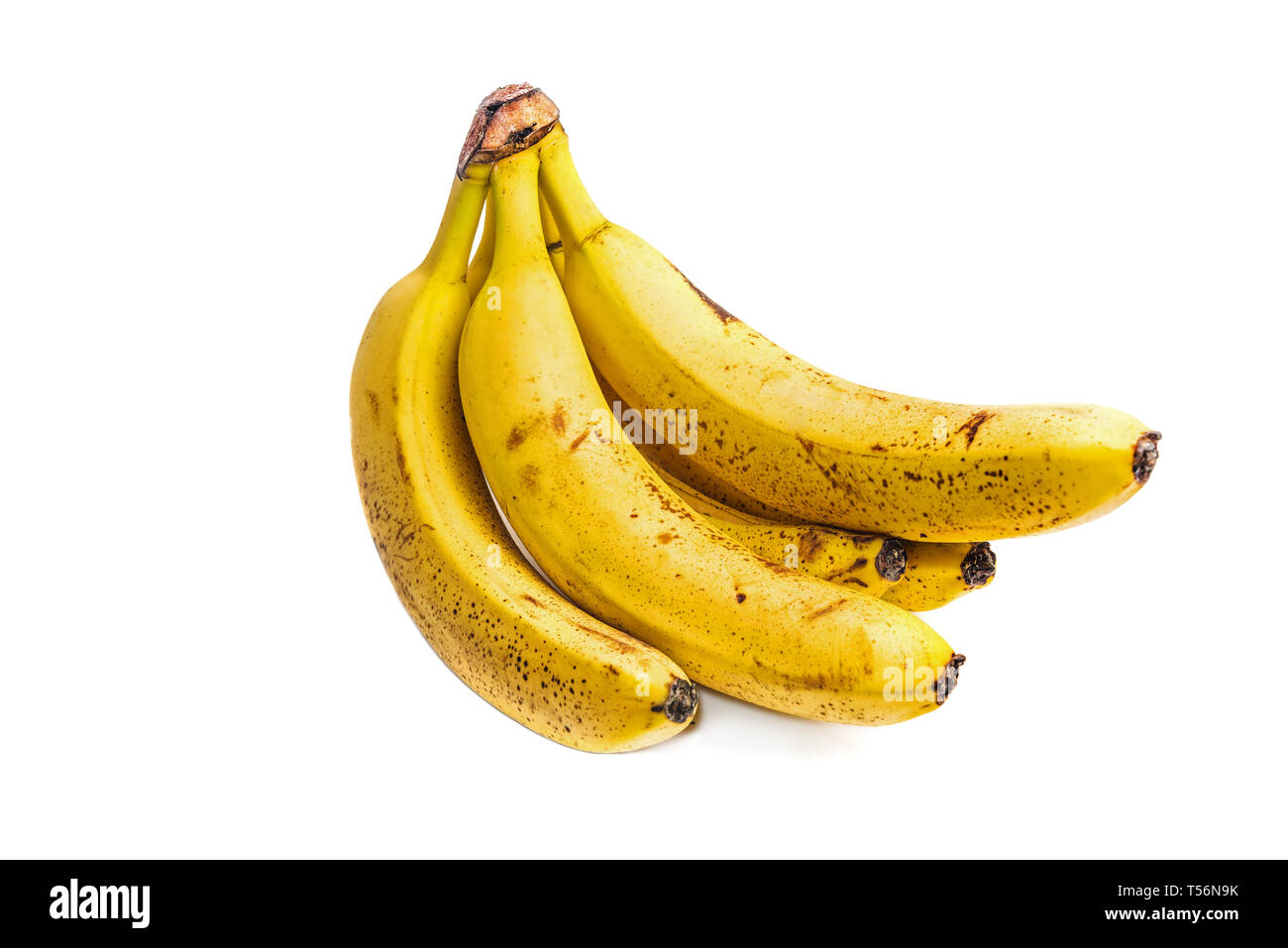 Bunch of Ripe Bananas with dark spots isolated on white Stock Photo