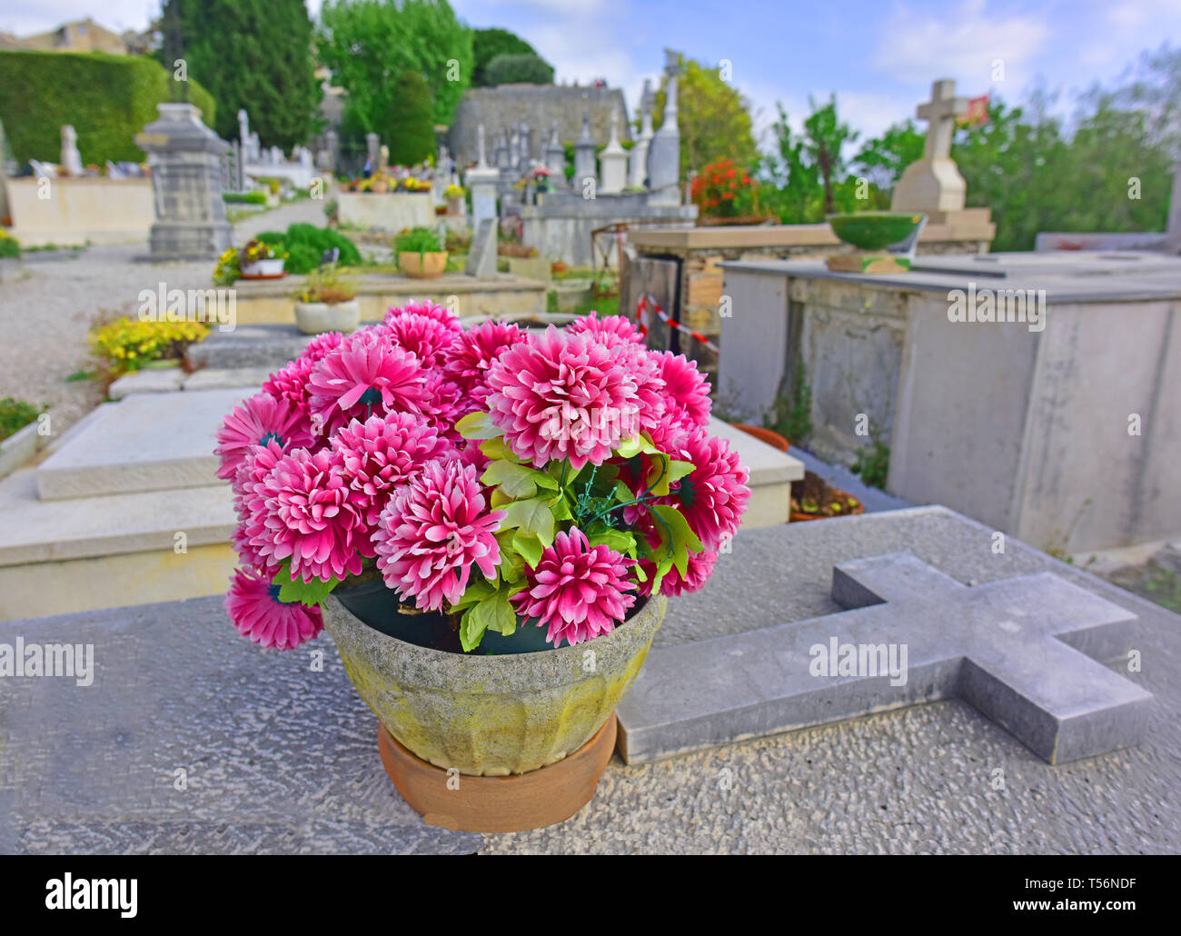 Flowers on gravestone in cemetery in St Paul de Vence, France Stock