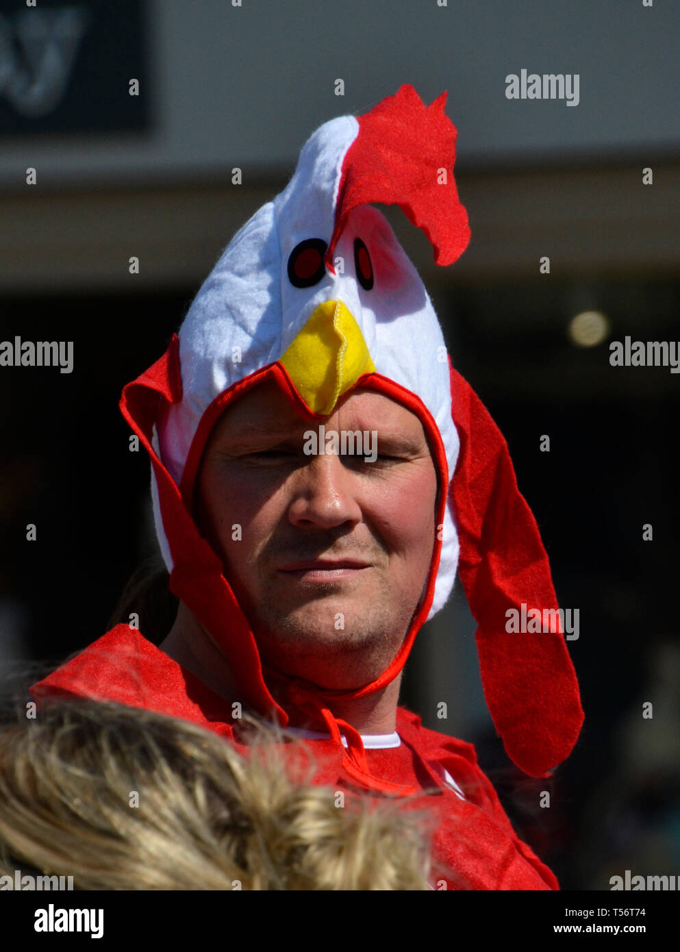 Teams taking part in the annual Good Friday Marbles Competition in fancy dress in Battle Market Square, Battle, East Sussex, UK Stock Photo