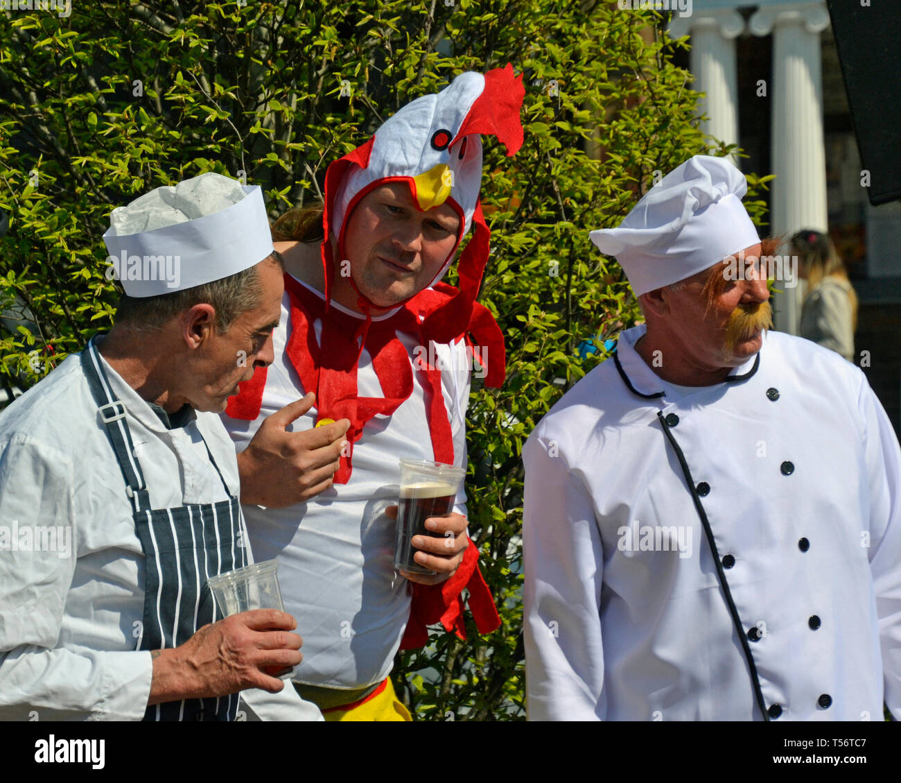 Teams taking part in the annual Good Friday Marbles Competition in fancy dress in Battle Market Square, Battle, East Sussex, UK Stock Photo