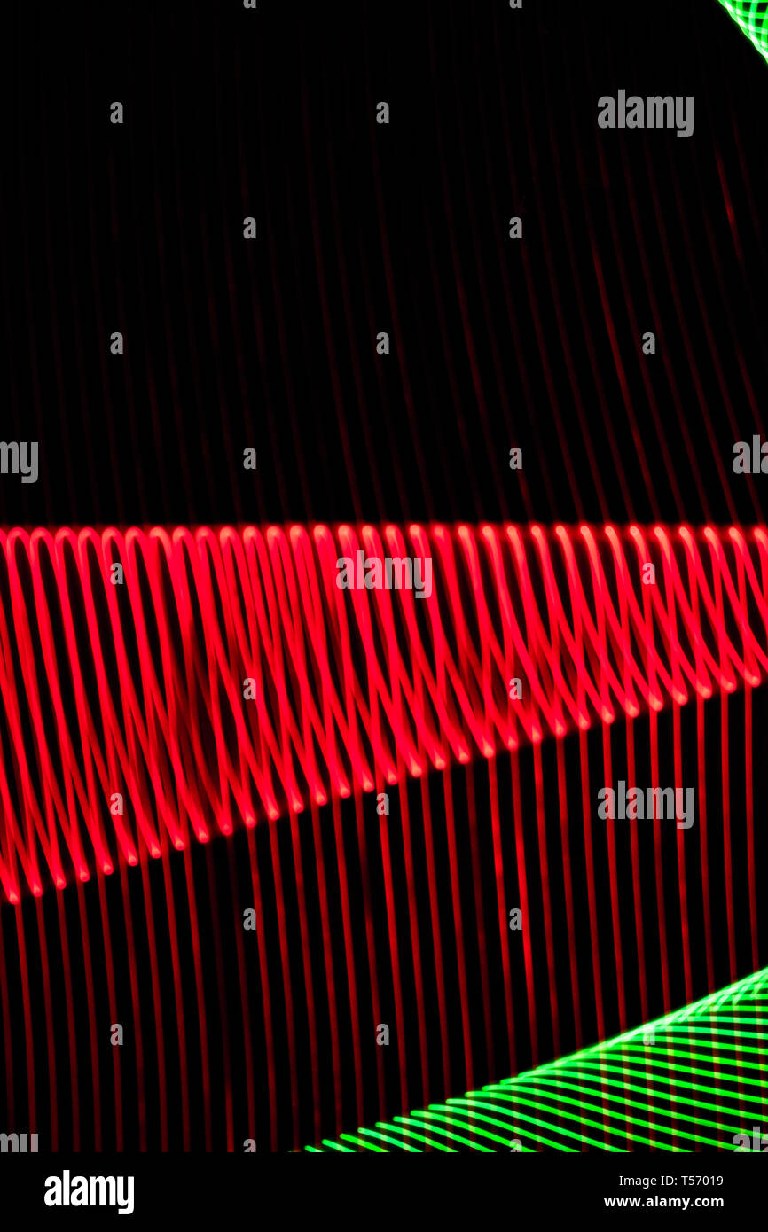 Abstract colorful lines on black background. Patterns of lines forming ...