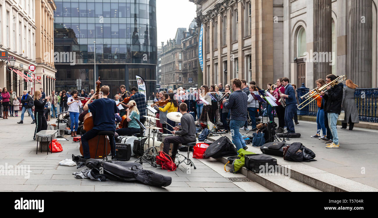 Singers and musicians from the Nevis Ensemble, 'Scotland's Street Orchestra' performing in Royal Exchange Square, Glasgow, Scotland, UK Stock Photo