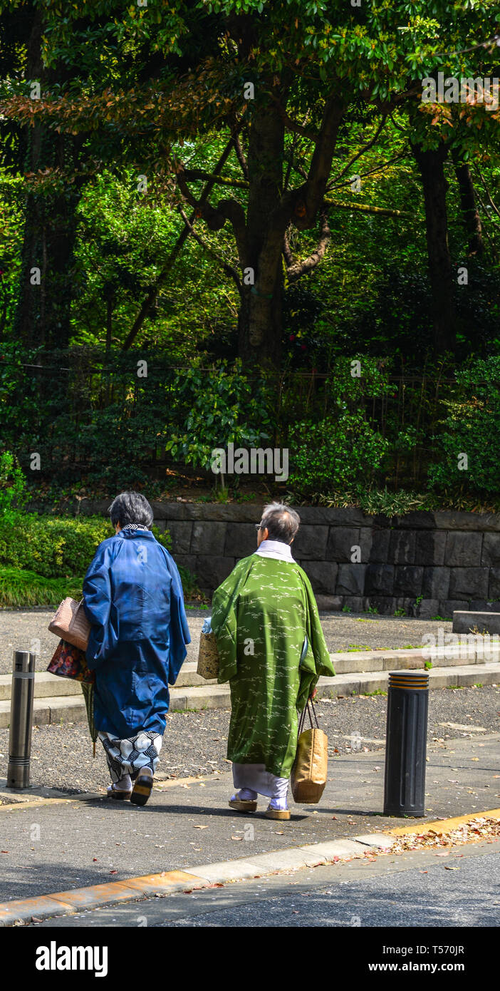 Tokyo, Japan - Apr 7, 2019. Old women in kimono dress walking on street ...