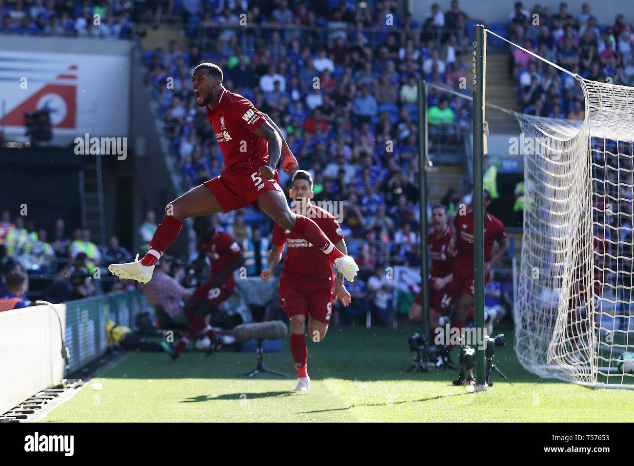 Cardiff, UK. 21st Apr, 2019. Georginio Wijnaldum of Liverpool (5) celebrates after he scores his teams 1st goal. Premier League match, Cardiff City v Liverpool at the Cardiff City Stadium on Sunday 21st April 2019. this image may only be used for Editorial purposes. Editorial use only, license required for commercial use. No use in betting, games or a single club/league/player publications. pic by Andrew Orchard/Andrew Orchard sports photography/Alamy Live news Credit: Andrew Orchard sports photography/Alamy Live News Stock Photo