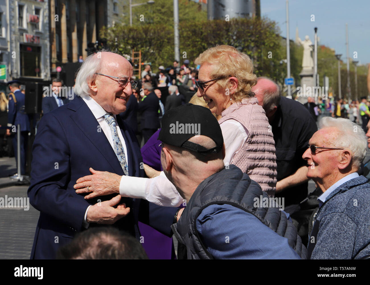 Dublin. 22nd Apr, 2019. Irish President Michael D. Higgins(1st L) talks with local residents during a ceremony commemorating the 103rd anniversary of Easter Rising in Dublin, Ireland, April 21, 2019. The Easter Rising is an armed insurrection launched by the Irish republicans to end the British rule in Ireland. It began on Easter Monday, April 24, 1916, and last for six days. Credit: Xinhua/Alamy Live News Stock Photo