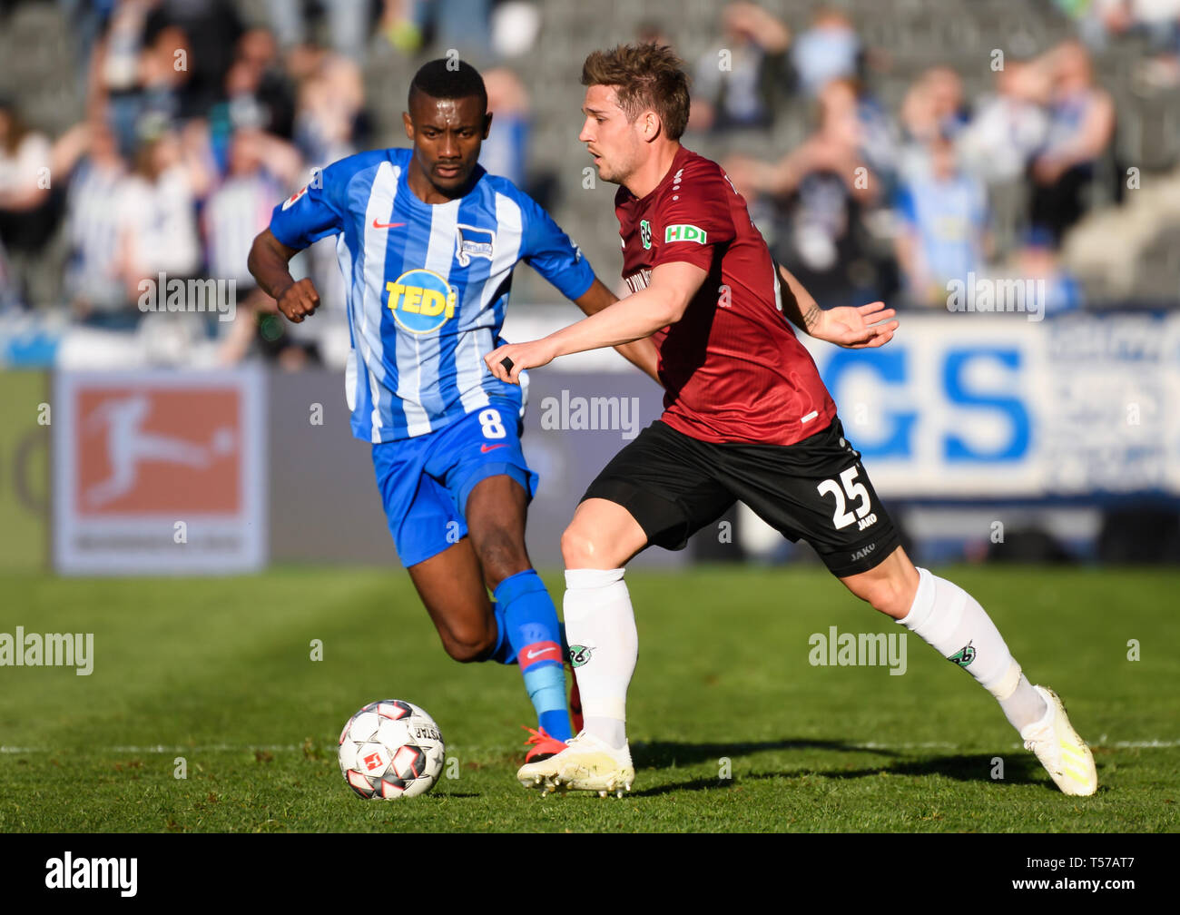 Berlin, Germany. 21st Apr, 2019. Hanover 96's Oliver Sorg (R) controls the ball under the defense from Hertha's Salomon Kalou during a German Bundesliga match between Hertha BSC and Hanover 96 in Berlin, Germany, on April 21, 2019. The match ended 0-0. Credit: Kevin Voigt/Xinhua/Alamy Live News Stock Photo