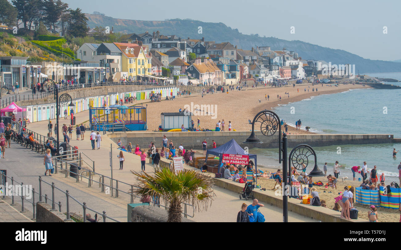 Lyme Regis, Dorset, UK. 22nd April 2019. UK Weather: Holiday makers and beach goers secure a spot early on the pretty beach at the seaside resort of Lyme Regis to enjoy a day of hot and hazy sunshine on the Bank Holiday.  Visitors have enjoyed record breaking heat over the Easter weekend with temperatures set to soar even further today. Credit: Celia McMahon/Alamy Live News. Stock Photo