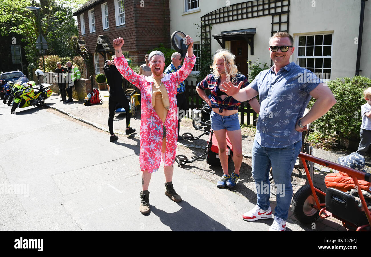 Bolney Sussex, UK. 22nd Apr, 2019. Competitors celebrate finishing the annual Bolney Pram Race in hot sunny weather . The annual races start and finish at the Eight Bells Pub in the village every Easter Bank Holiday Monday Credit: Simon Dack/Alamy Live News Stock Photo