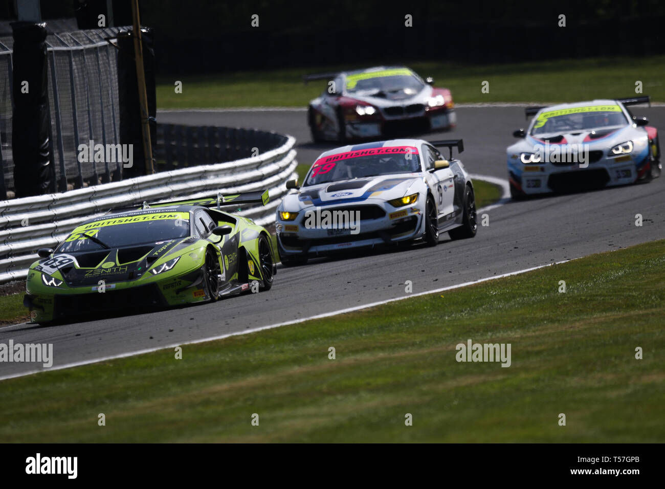 Taporley, Cheshire, UK. 22nd Apr, 2019. Barwell Motorsport Lamborghini Huracan GT3 EVO with Pro/Am drivers Jonny Cocker & Sam De Haan leads a pack of cars during the British GT Championship Oulton Park at  Oulton Park, Tarporley, England on 22 April 2019. Photo by Jurek Biegus.  Editorial use only, license required for commercial use. No use in betting, games or a single club/league/player publications. Credit: UK Sports Pics Ltd/Alamy Live News Stock Photo