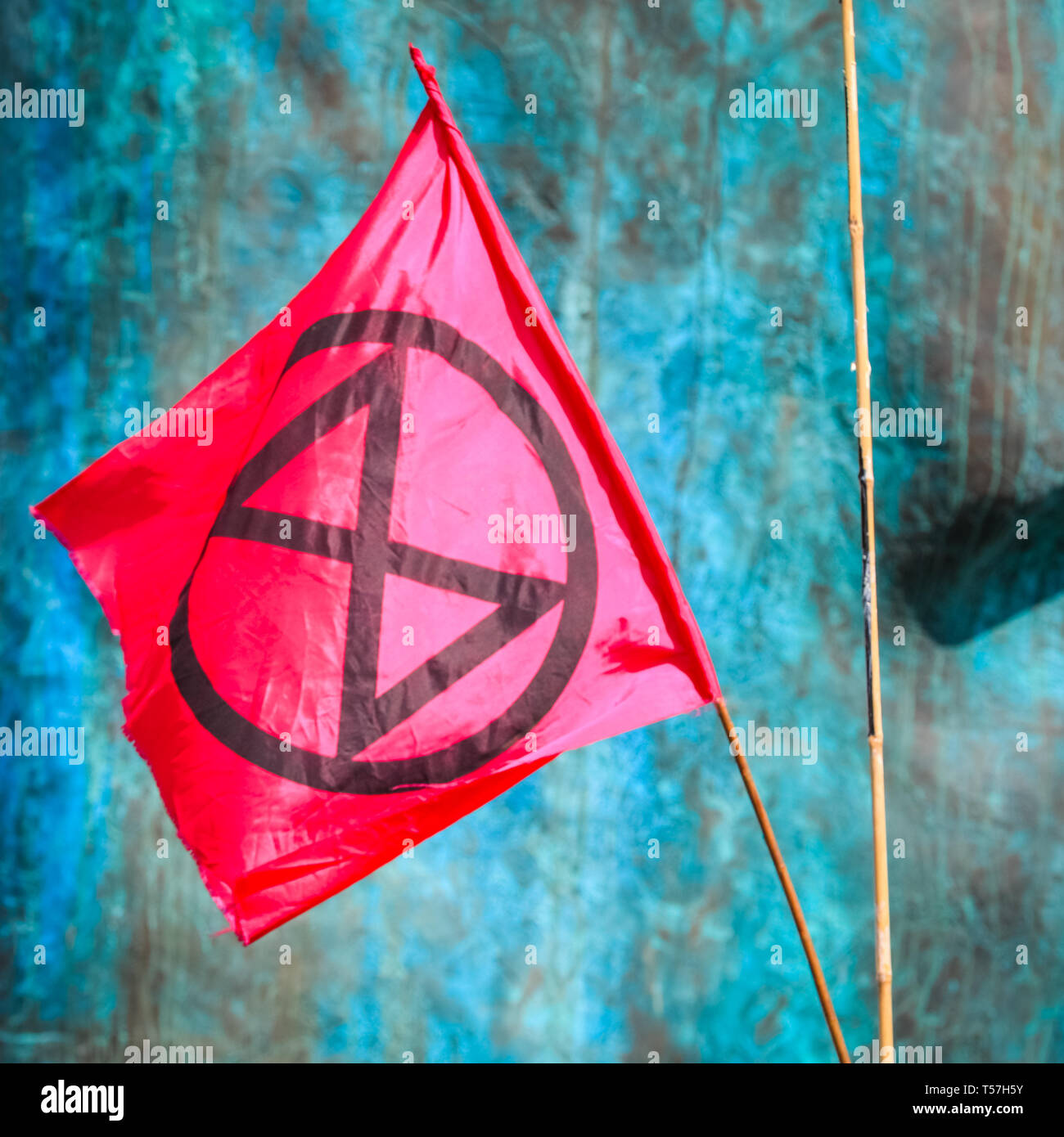 Marble Arch, London, UK. 22nd Apr, 2019. The Extinction Rebellion Logo at Marble Arch. Activists once again protest largely peacefully in bright sunshine at Marble Arch. Campaigners were back at Marble Arch - the only Met-sanctioned protest space - on Monday, as activists met to plan the week ahead. The Marbe Arch site includes a large tented area for protesters to sleep and rest. Credit: Imageplotter/Alamy Live News Stock Photo