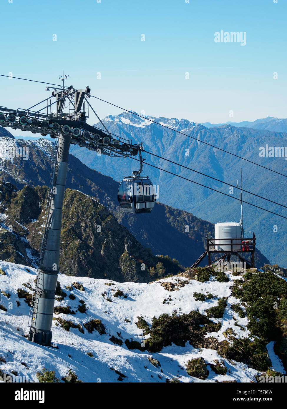 Cable Car Strut And Cabin In High Snowy Mountains Stock Photo
