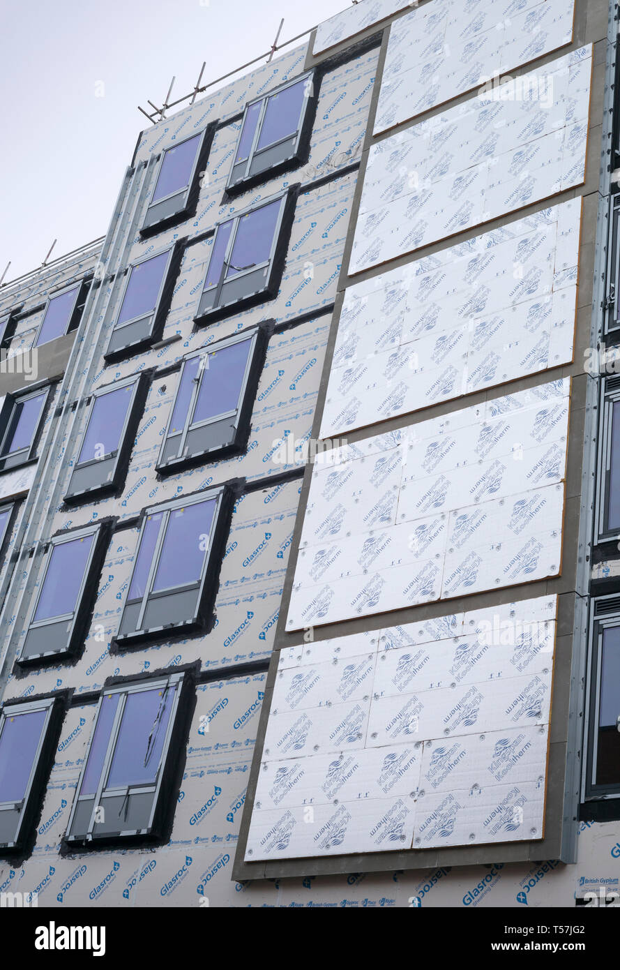 Insulation panels and double glazed windows on exterior wall of