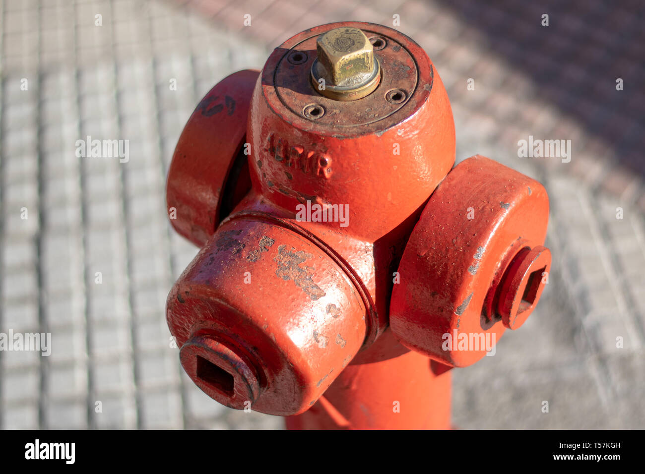 Hydrant on the sidewalk whith the word “abrir” that means open in spanish. Europe. Closeup. Stock Photo