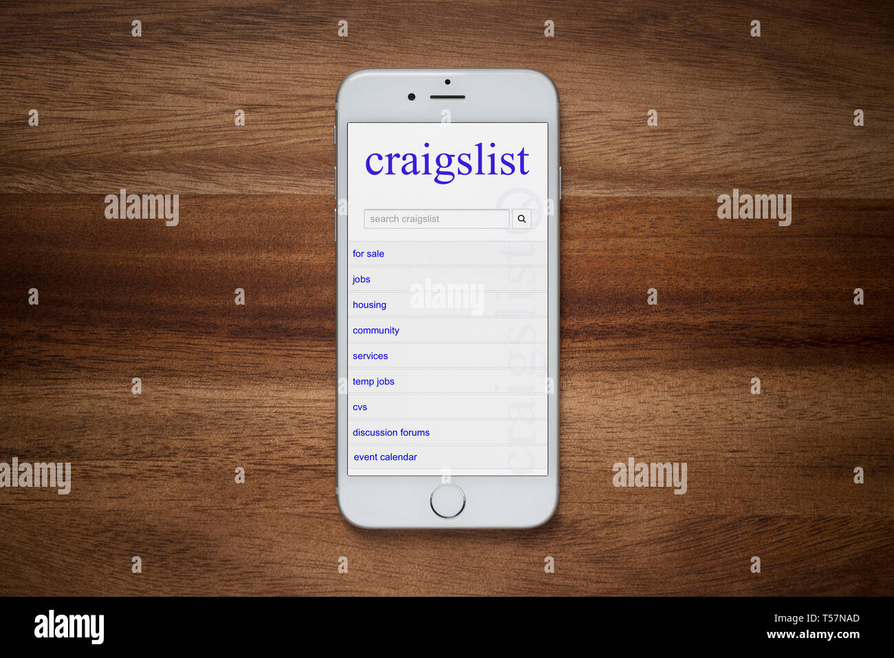 https://c8.alamy.com/comp/T57NAD/an-iphone-showing-the-craigslist-website-rests-on-a-plain-wooden-table-editorial-use-only-T57NAD.jpg