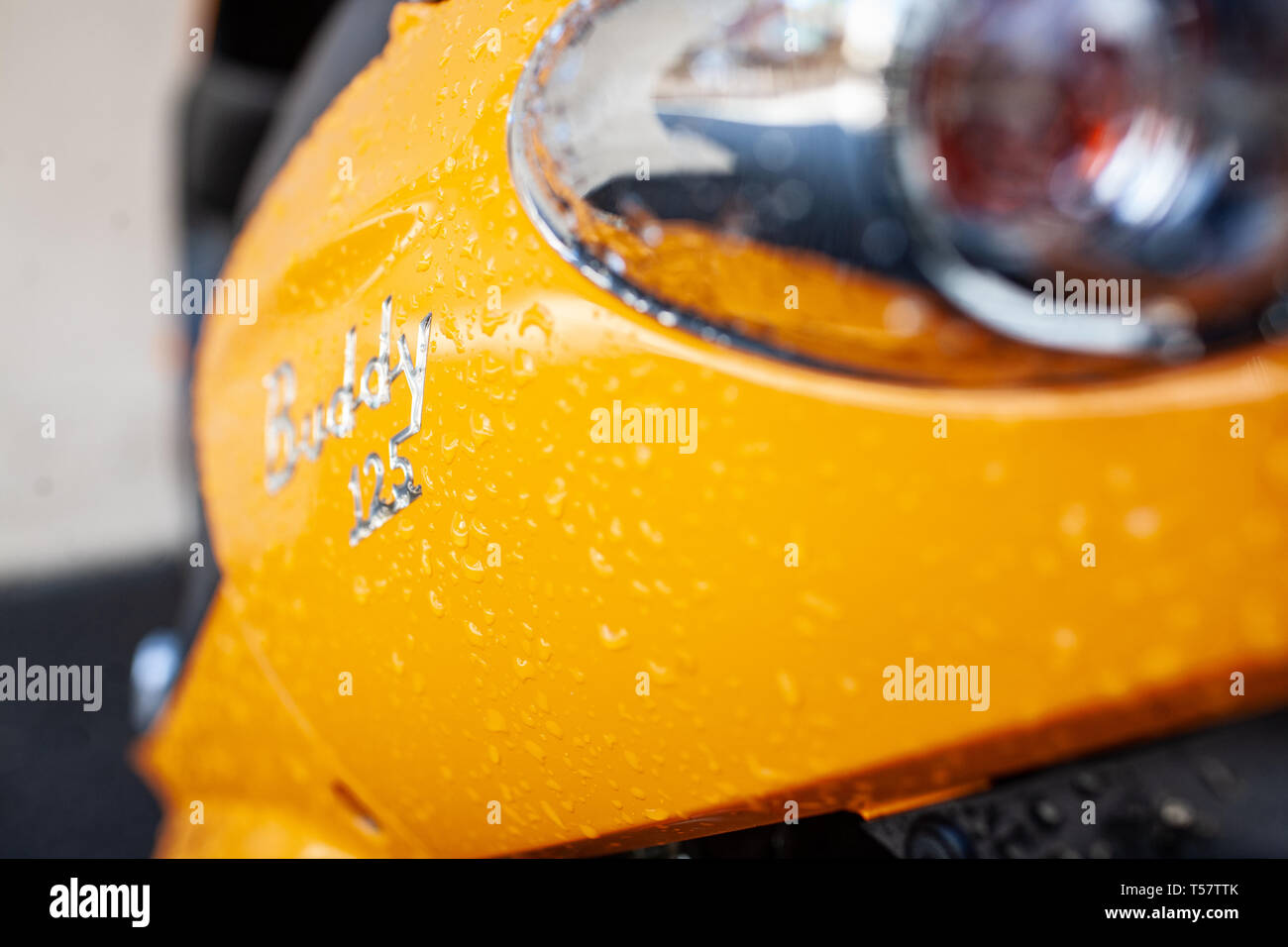 Moped in rain hires stock photography and images Alamy