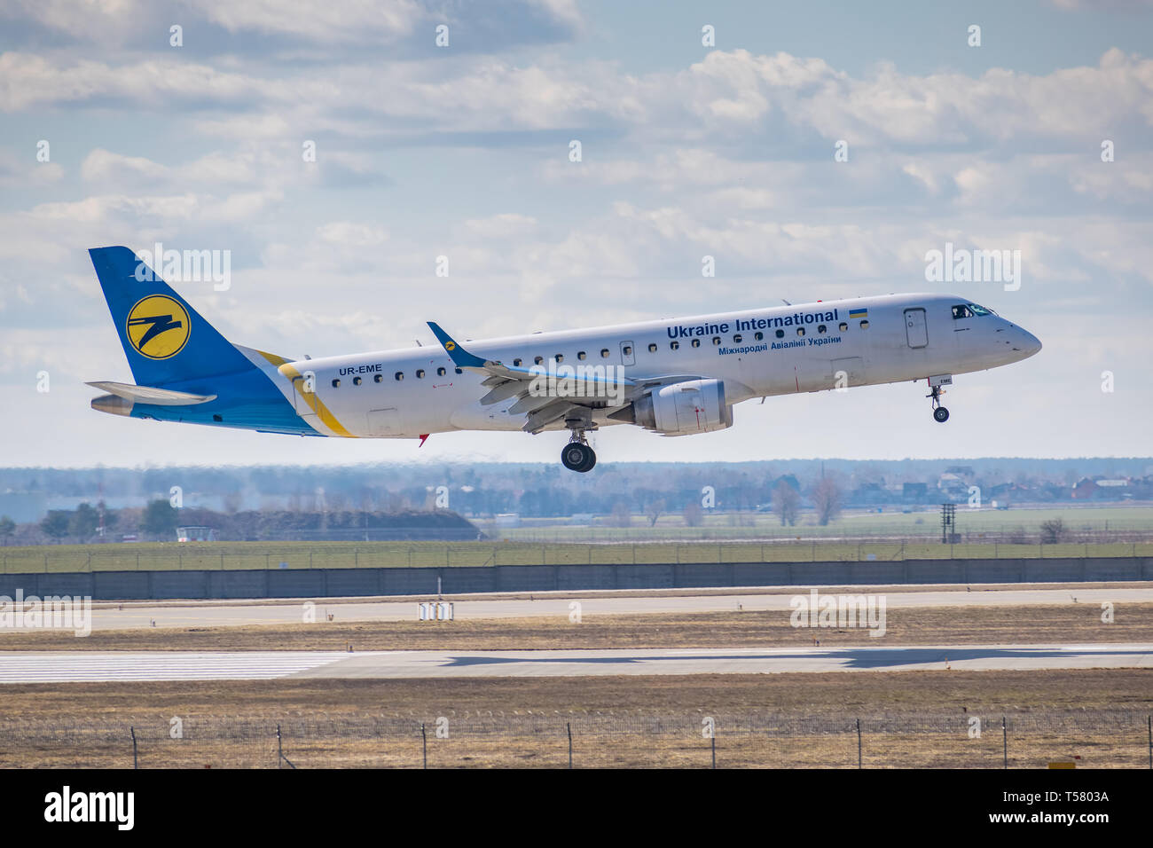 Kyiv, Ukraine - March 17, 2019: Ukraine International Airlines Embraer ERJ-190 on short final landing in the airport Stock Photo