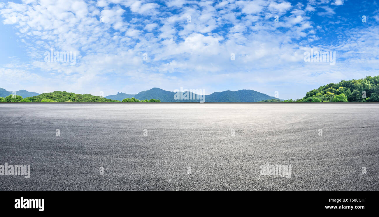 Asphalt race track ground and mountains with blue sky landscape Stock ...
