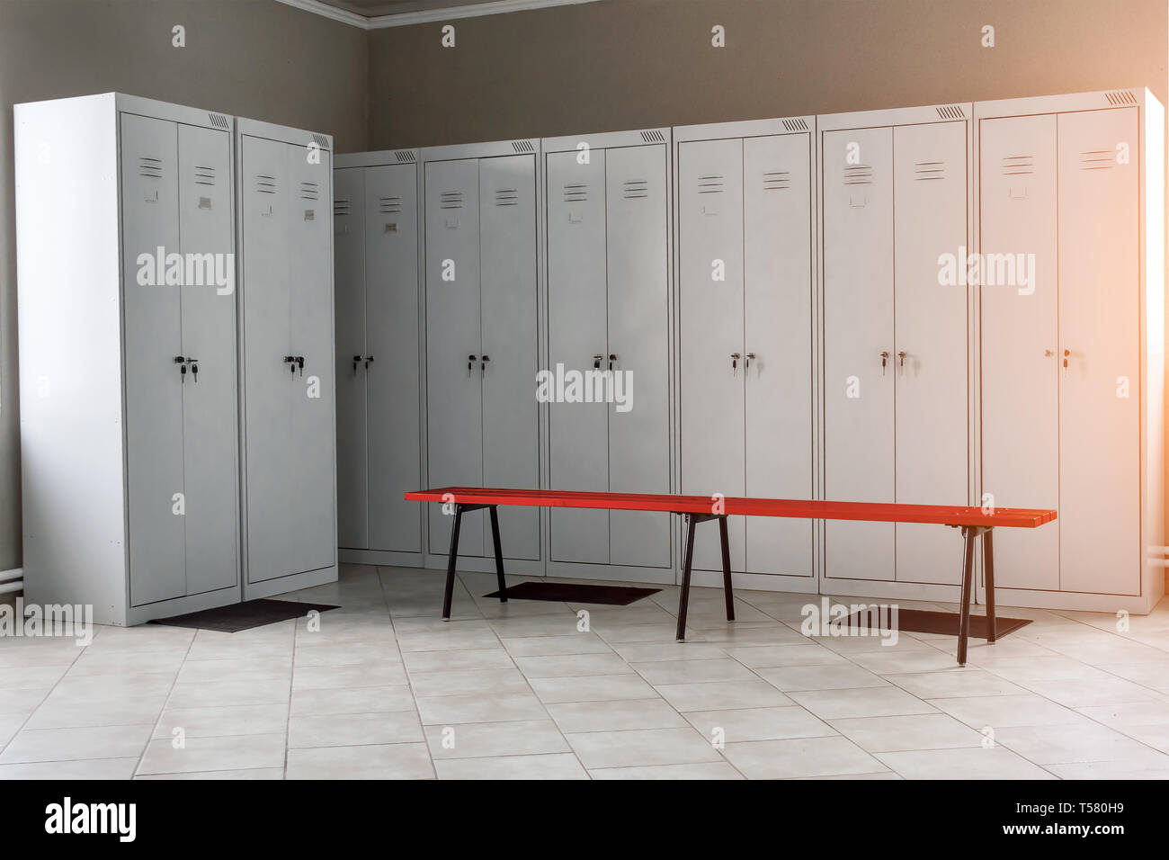 locker room in the gym  with metal drawers and benches Stock Photo