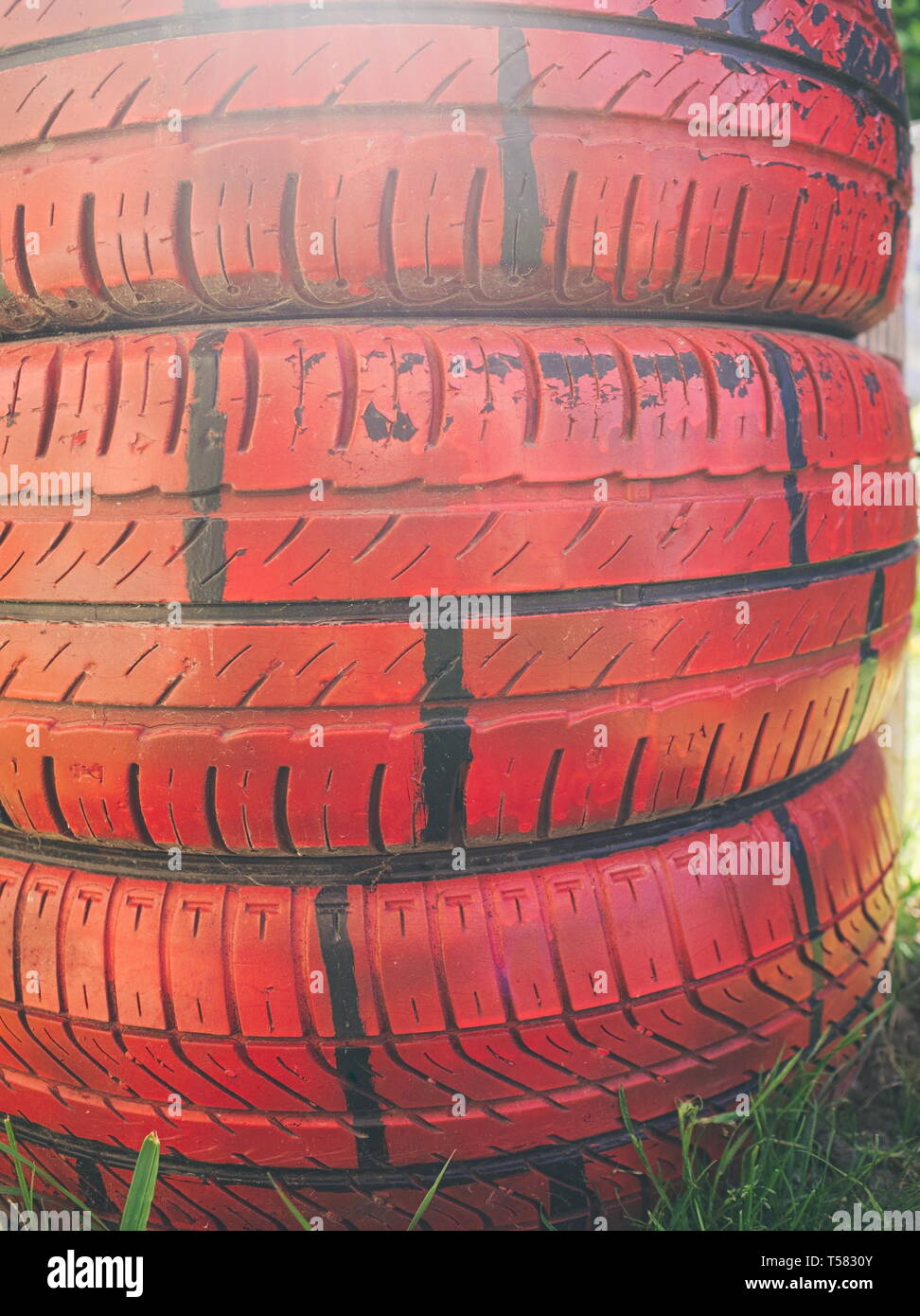 Red Painted Car Tires In The Garden Closeup Stock Photo Alamy Red Painted Car Tires In The Garden Closeup Stock Photo Alamy