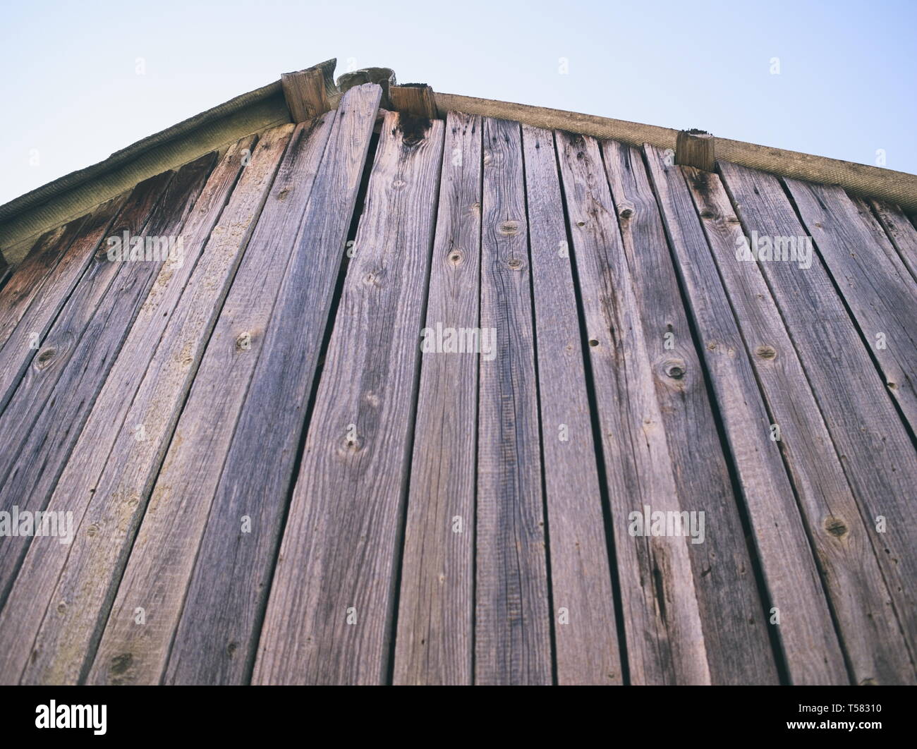Wooden Shack Roof with Blue Sky Closeup Stock Photo