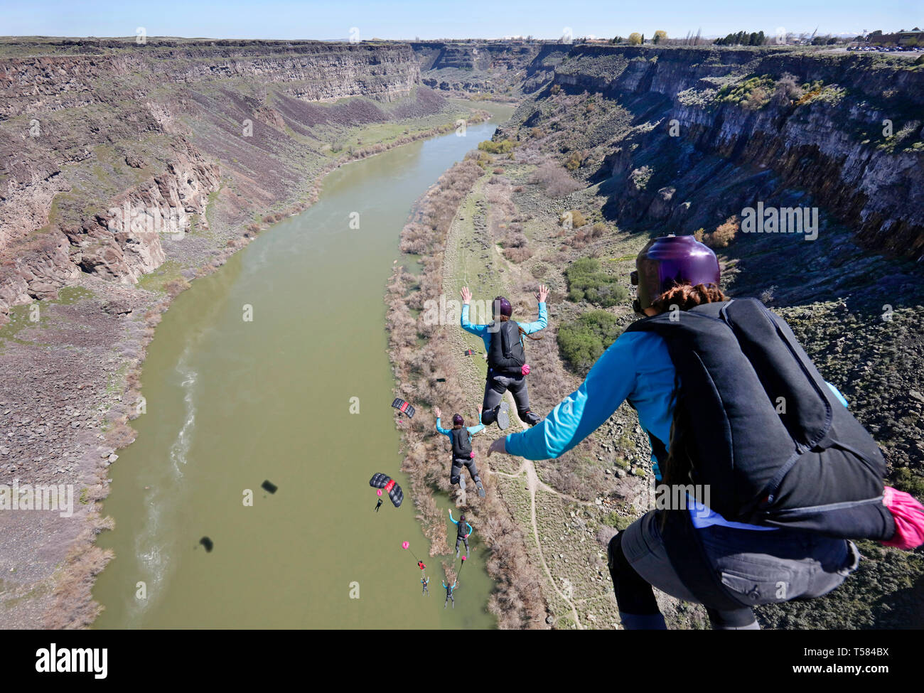 Multiple exposures of base jumper. View from the top of the Perrine Bridge, landing on the shore of the Snake River Canyon in Idaho. Stock Photo