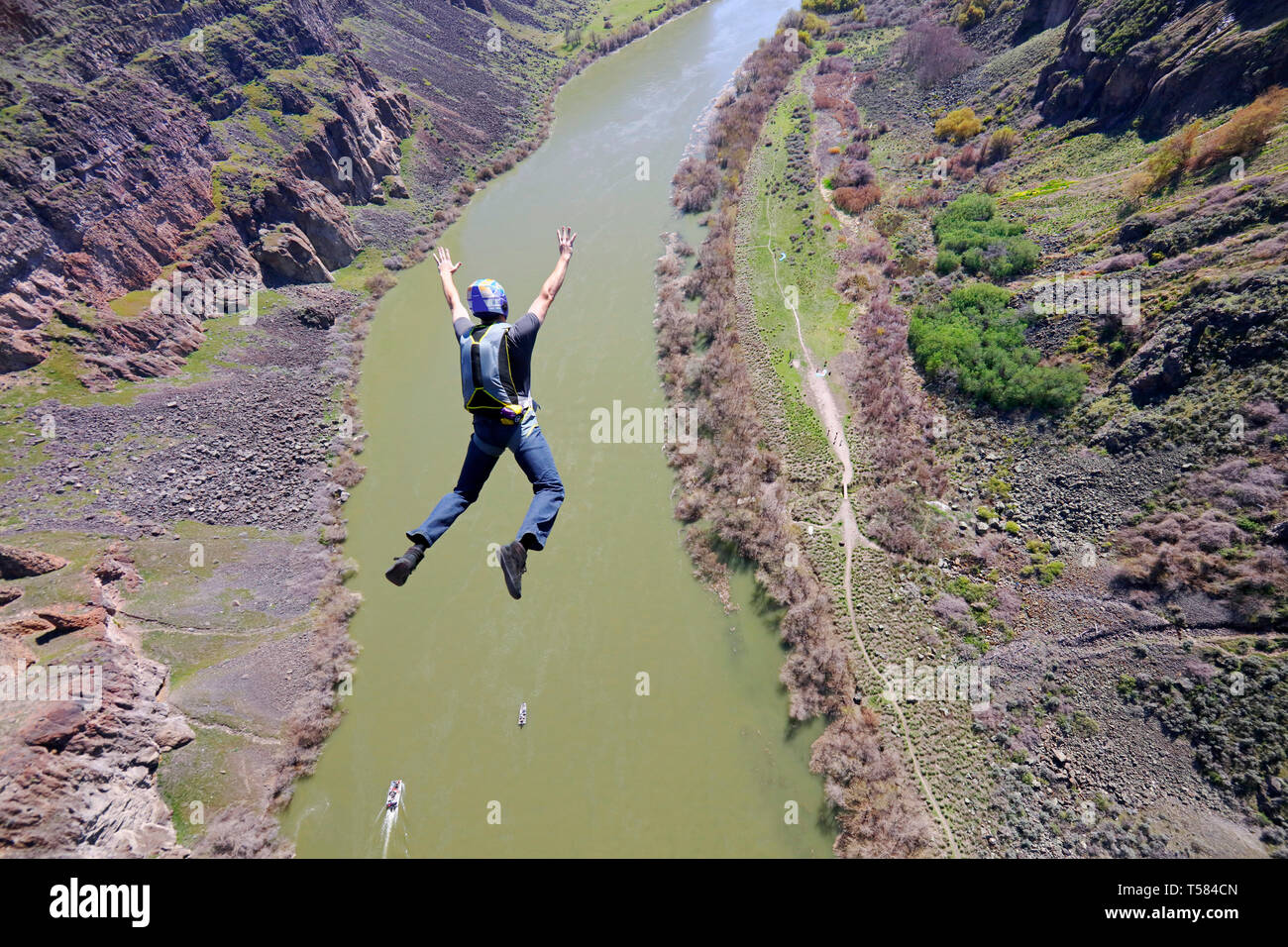 Base jumper viewed from the top of the Perrine Bridge over the Snake River Canyon in Idaho. Stock Photo