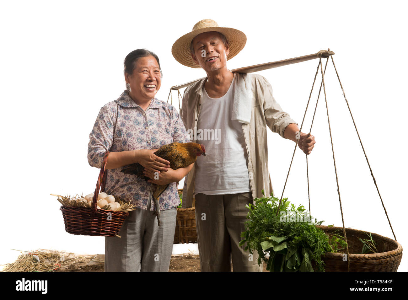 Farmers couples with vegetables and poultry Stock Photo