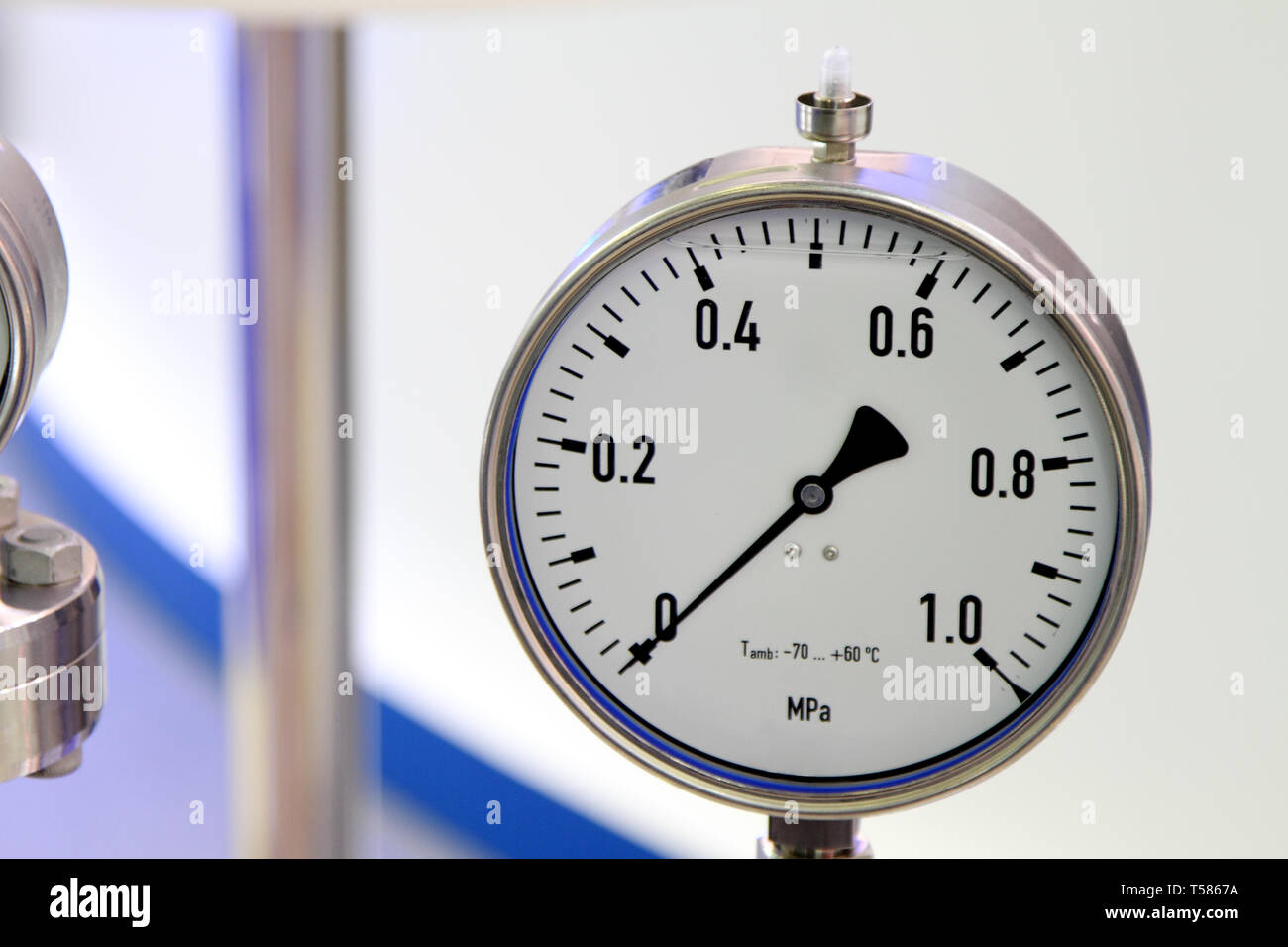 Pressure gauge - a device for measuring the pressure of fluid in the pipeline. Stock Photo