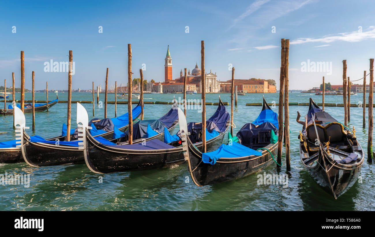 Venice gondolas at sunny day near San Marco square, Venice, Italy. Stock Photo