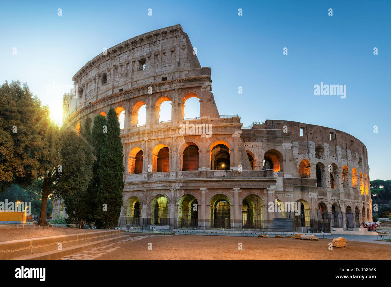 Famous Colosseum at sunrise in Rome, Italy, Stock Photo