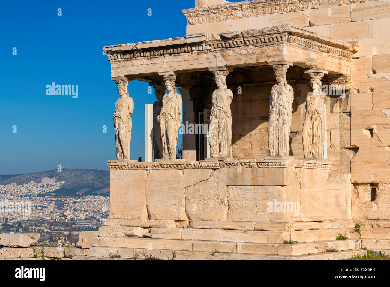 Ancient Erechtheion temple with Caryatid Porch on the Acropolis near Parthenon, Athens, Greece. Stock Photo