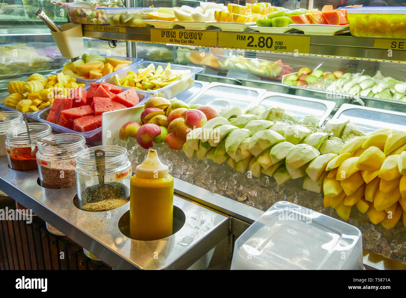 Fresh fruits cut in pieces selling at the fruit stall in Malaysia Stock