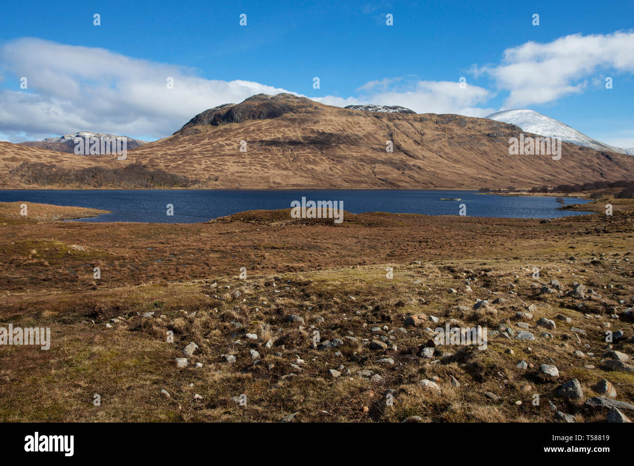 Loch Ba and snow covered mountains Isle of Mull Inner Hebrides Argyll and Bute Scotland March 2017 Stock Photo