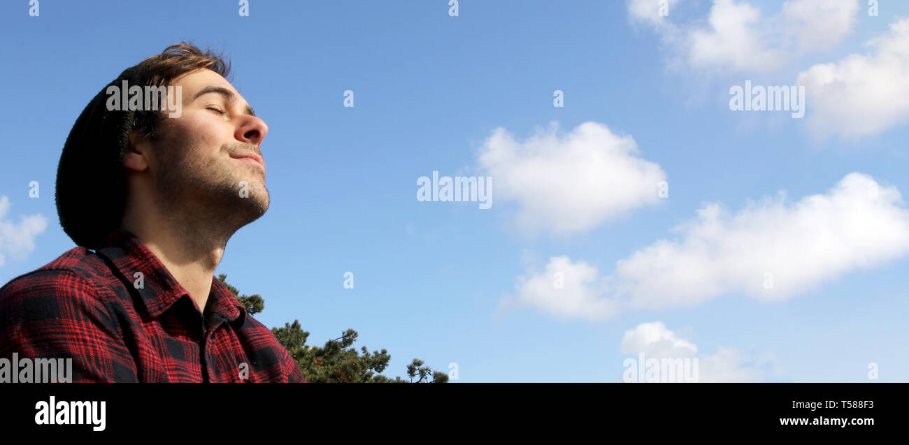 Caucasian Man Relax And Smile On A Blue Sky And White Clouds Background To Be Used As A Banner Symbolising Freedom And Dreams Stock Photo Alamy