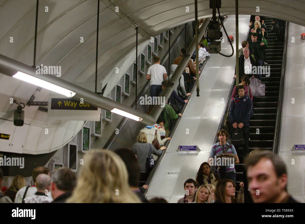 Commuters travelling on escalators during their daily commute on the London underground. 09/09