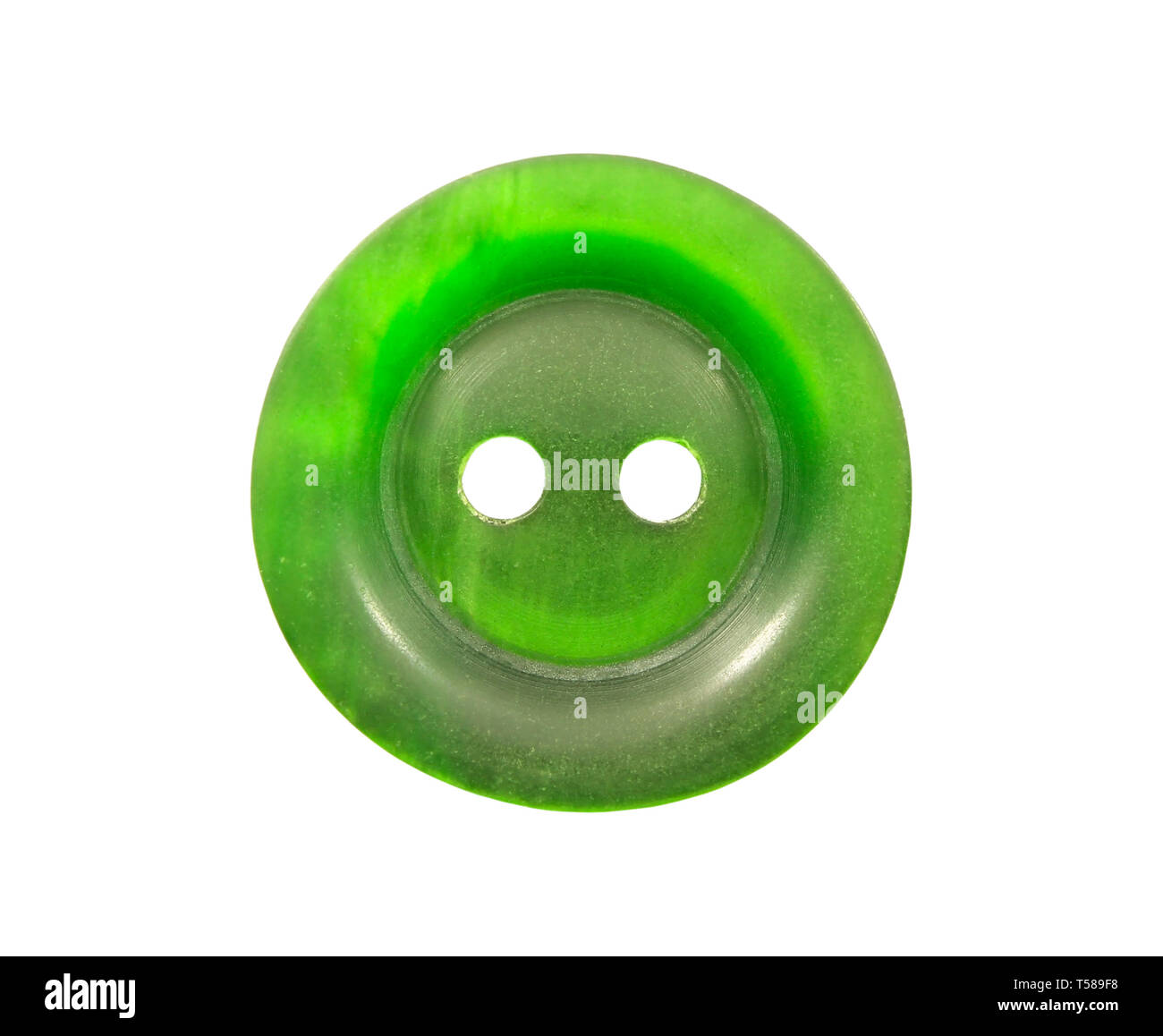 Green plastic button on the upper clothes isolated on white Stock Photo